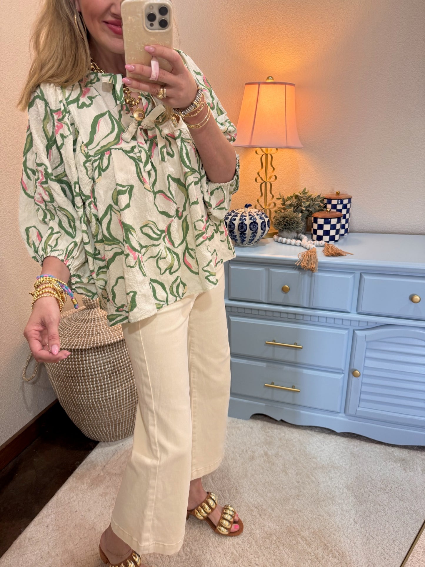 Textured floral printed blouse featuring batwing sleeves with front ties
